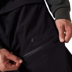 Oakley TNP Shell BIB Trägerhose Blackout Herren -Skiausrüstung Geschäft oakley tnp shell bib foa400939 02e 03 gross